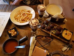 amazing tomato soup, fries, 2 vegan hot chocolates and falafel balls at Step Out Cafe in Jaipur