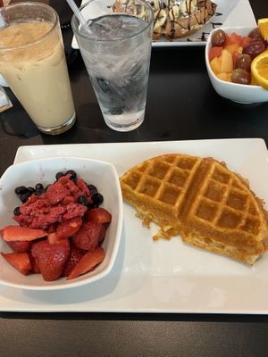 Vegan waffles & fruit and an iced vanilla soy latte 🤤 at Waffles INCaffeinated - Fifth Ave in Pittsburgh