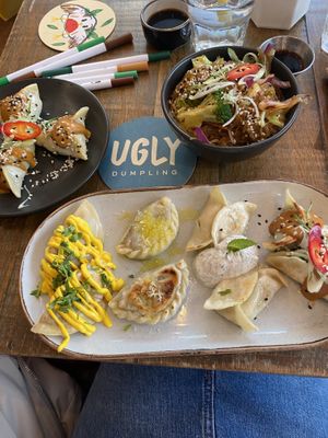 Gf spinach & tofu dumplings (left); gf ugly noodles (right); veggie platter (front)  at Ugly Dumpling in London