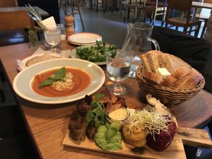 From the left: soup of the day, vinagrette salad side dish, the tasting board with plantedeller, remoulade, herb creme, tarragon mayo, hummus with lemon, beetroot tartar, bread  at Din Nye Ven in Copenhagen