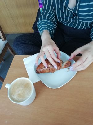 Latte and a blueberry croissant at Limau in South West London