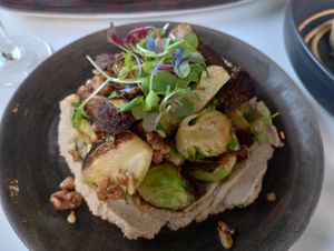 Brussel sprouts over hummus with walnuts at Bistro Tendresse in Montreal