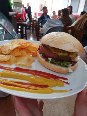 Beyond burger sevida con patatas de pimentón at Mostaza y Media in Gijon