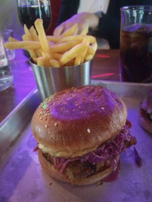 Dirty Chkn Burger with a side of fries at Dirty Vegan in Stockholm