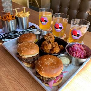 Cheesy burger, two onion burgers, buffalo cauliflower, truffle mayo, fries and slaw🤤 at Dirty Vegan in Stockholm