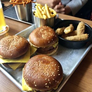 Double cheese burgers all round, and mozzarella sticks! at Dirty Vegan in Stockholm