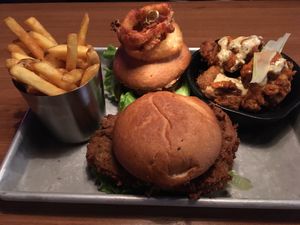 3 onions burger & chicken burger. Plus fries and chicken wings at Dirty Vegan in Stockholm