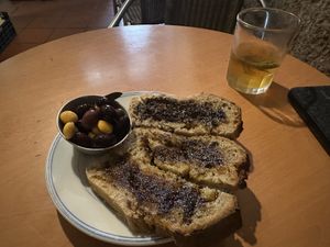 Starter bread, olives, and lupine. House kombucha was so good!  at Casa da Horta in Porto