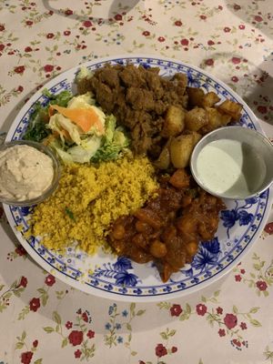 Hummus, salad, couscous, chickpea/tomatoes, potatoes, soy ground “meat”, and a garlic sauce at Casa da Horta in Porto
