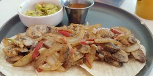 $8.50 Wild Mushroom Tacos with a side of guacamole: Delicious and filling. Guacamole webt really well with them. at Juicery Plus - E Main St in El Paso