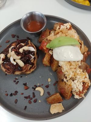 Migas with side of chocolate pancakes: Delicious, I really liked the chocolate pancakes but still prefer the banana pancakes, Migas and Benedict are my favorite breakfast items at Juicery Plus - E Main St in El Paso