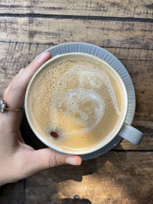 Cappuccino with oat milk made in house   at Flowers & Fire in 