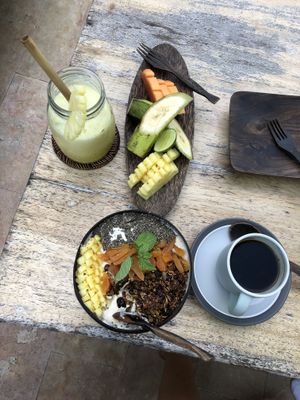 Pineapple juice, smoothie bowl, fruit plate  at Flowers & Fire in 