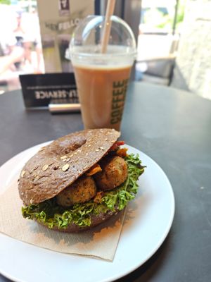 Falafel bagel, oat iced latte at Coffee Fellows - Alexanderplatz in Berlin
