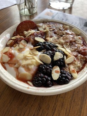 Cardamom porridge with nut butter, fruit & almonds at Wild Thing in Cardiff
