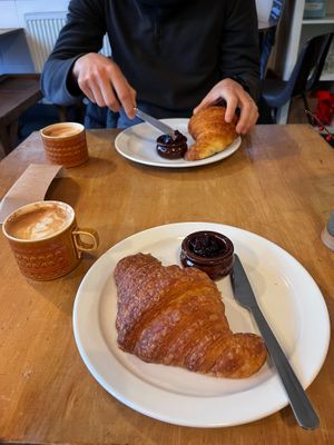 Croissant with jam and oat flat white   at Wild Thing in Cardiff