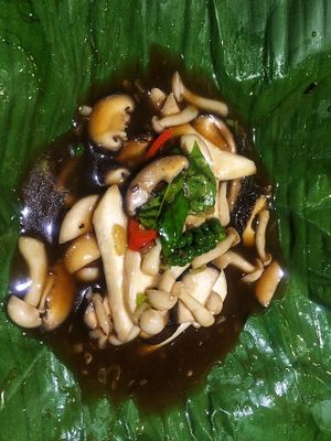 Three-flavored mushrooms steamed in banana leaf at Phuc An in Da Nang