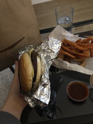 Vegan Moo less burger with cheese and sweet potato fries and onion rings  at BRGR in Edinburgh