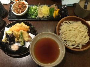 Vegetable tempura, toppings for the udon, broth, and the noodles at Omen Nippon in Kyoto