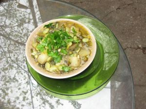 Lima bean apple cider stew served on quinoa. at La Lumiere du Mile End in Montreal