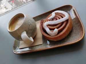 Flat white and cinnamon bun at Matcha Bar in Copenhagen