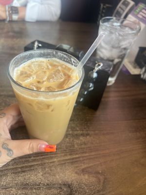 Iced latte with oat milk add hazelnut   at Tryst Cafe in Chandler