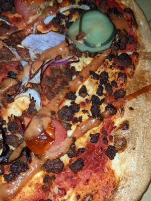 Burnt and dry toppings on the royale pizza. at Crust Gourmet Pizza Bar in Richmond