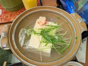 Silken tofu, cooking at the table at Saga Tofu Ine (Main Branch) 嵯峨とうふ 稲 本店 in Kyoto