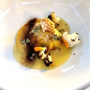 Lemon Pine Nut Raviolo with Scorched Cauliflower   at FREA in Berlin