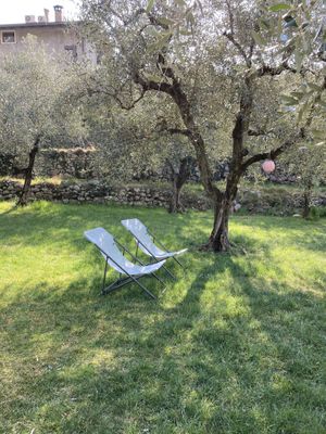 Lounge chairs to enjoy the garden  at Da La Babi in Arco