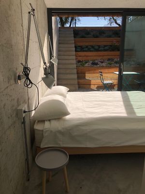 stylish queen bed room, with independent entrance and patio at Da La Babi in Arco