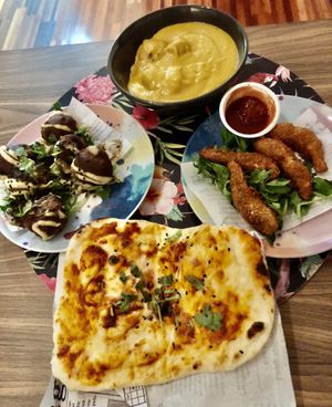 Falafels, butter chick’n, Kerala prawns, chili cheese naan at Nalinis Wholesome Streetfood in Bondi Beach
