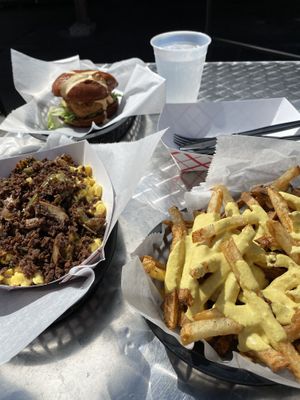 Philly Mac and cheese with cheesy fries and chick’n sandwich  at Evolve Modern Vegan Kitchen in Daytona Beach
