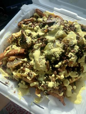 Philly cheesesteak fries. Not photogenic but 11/10 for taste. at Evolve Modern Vegan Kitchen in Daytona Beach