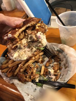 Custom chickn sandwich with pulled jackfruit, slaw and smash sauce, spicy marg was 🔥 too  at Evolve Modern Vegan Kitchen in Daytona Beach