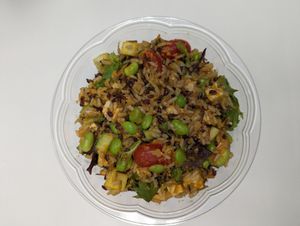Grain bowl with quinoa, mixed greens, tofu, veggies and vegan dressing. at MAD Greens in Highlands Ranch