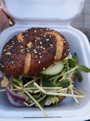 Bagel with almond cream cheese, sprouts, hummus & cucumbers at Coco's Cafe in Jasper