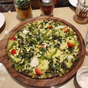 Grinch pizza - Lots of greens with a pesto base ✅ at Earth Cafe @ Waterfield in Mumbai