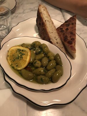 Olives in hot oil and focaccia  at Radis in Montreal