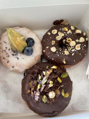 Chocolate hazelnut, chocolate crunchy, lemon and poppy seed donuts. at COCO Donuts in Brussels