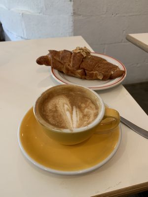 Flat white and almond croissant  at The Fields Beneath in North West London