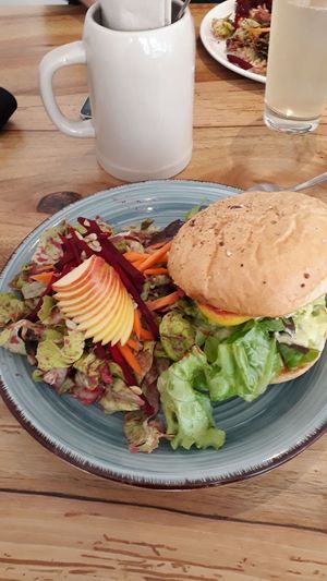burger with "cheese" and side salad at Littelhaso in Freiburg