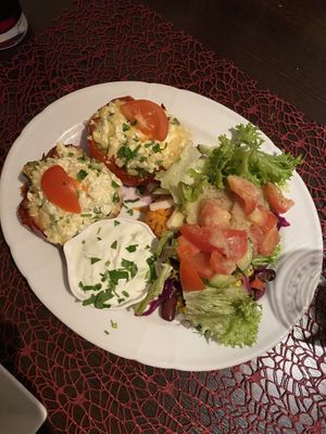 Peppers stuffed with potato cheese filling, served with salad, cacik and flatbread  at Posthörnle in Schwabisch Hall