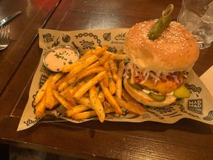 The mad nashville (with cheese) and cajun fries at Mad Mad Vegan - Chueca in Madrid