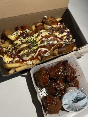 curry wurst fries and wings  at Mad Mad Vegan - Chueca in Madrid