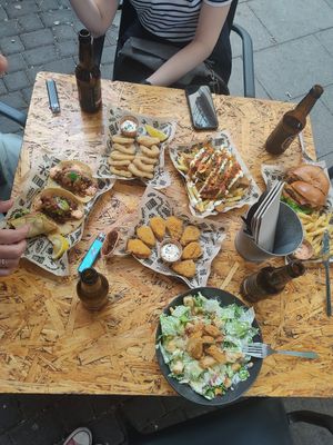 tacos, non-octopus rings, bavarian sausage, burger with vacon, non-chicken wings, caesar salad at Mad Mad Vegan - Chueca in Madrid