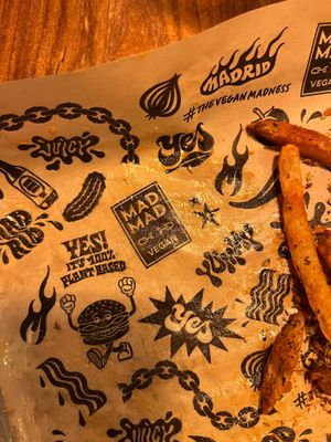 A lot of attention to detail — even the paper used under food has the restaurant‘s design. at Mad Mad Vegan - Chueca in Madrid