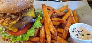 Beyond meat burger with sweet potato fries  at Mad Mad Vegan - Chueca in Madrid