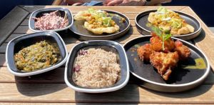 Peas and rice, callaloo, Trini doubles, coleslaw, sweetcorn fritters  at Turtle Bay in East London