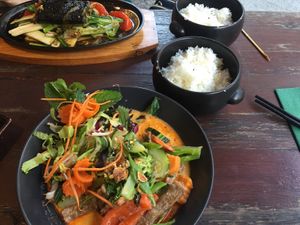 Thai curry (bottom) and cha ca (top) with accompanying rice at Tiato in Berlin